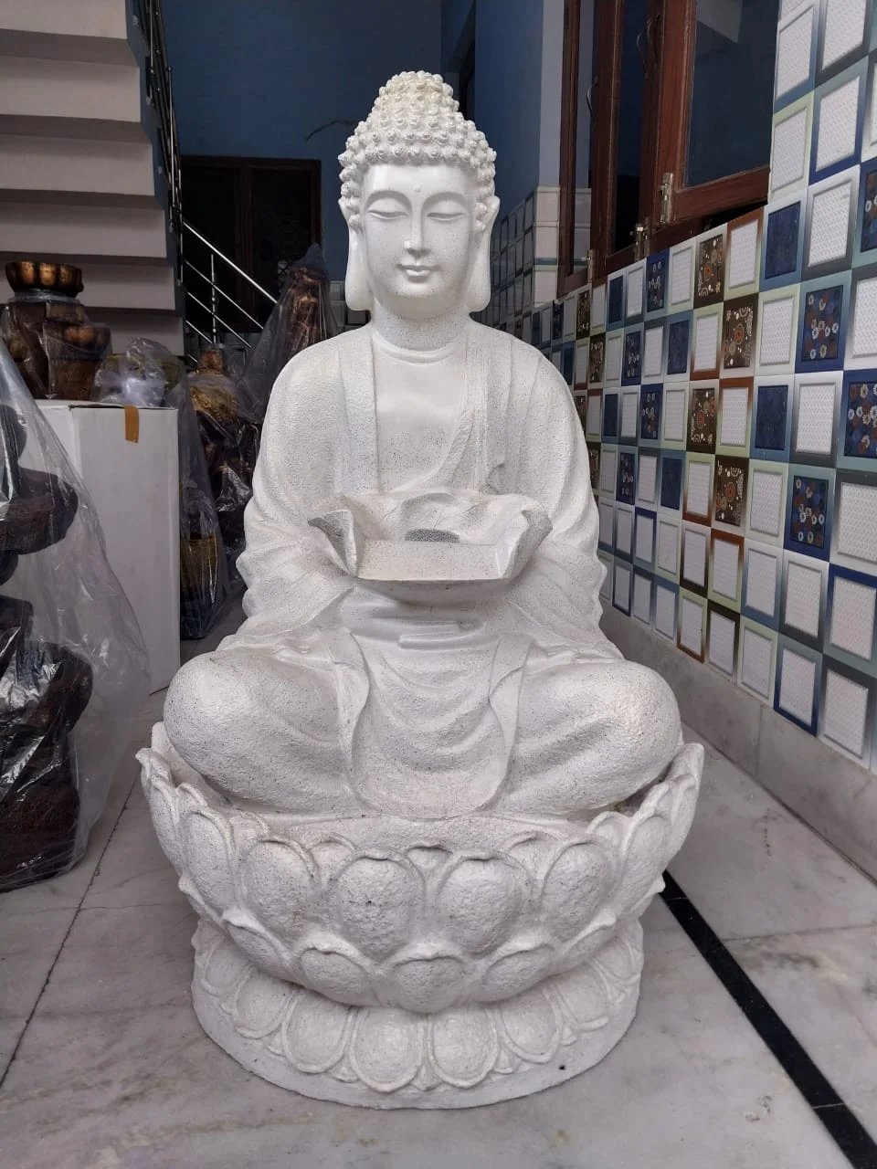 Buddha fountain lotus meditating